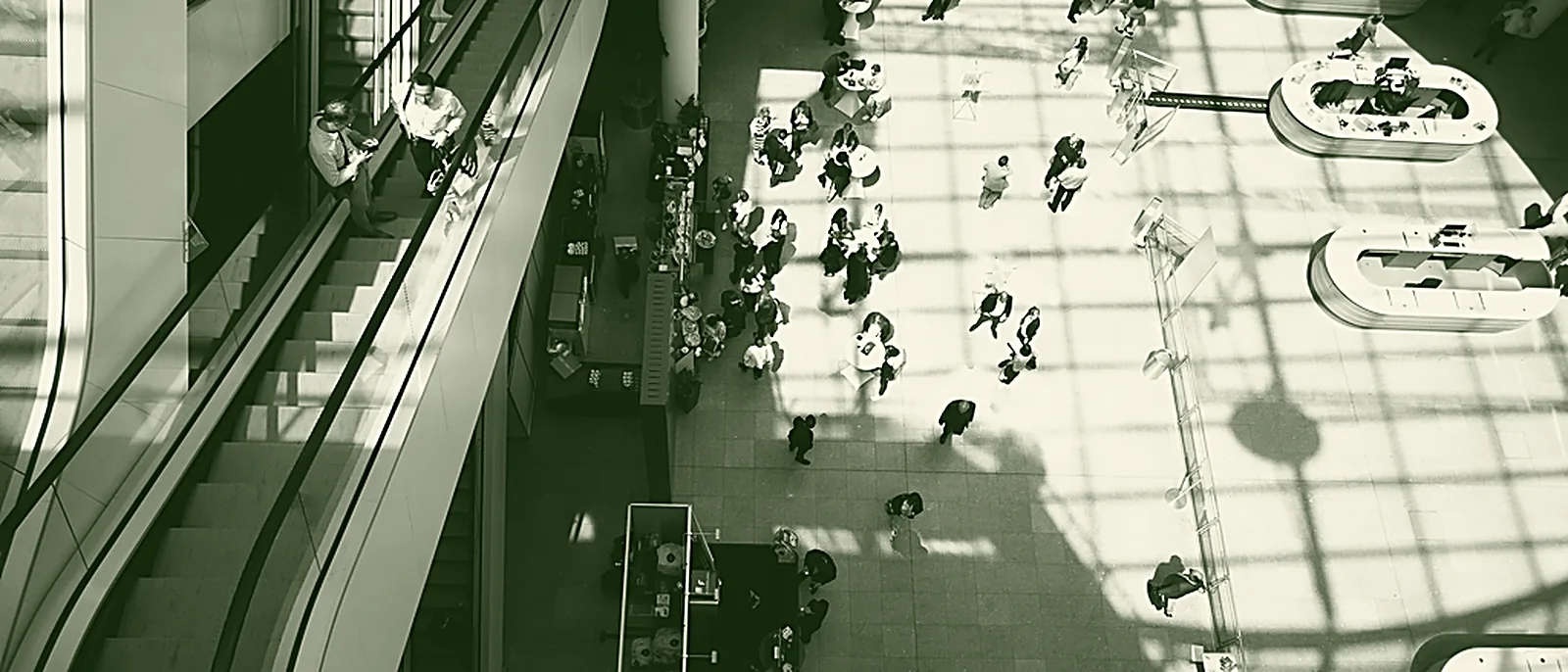 Escalators crossing inside a modern shopping mall atrium
